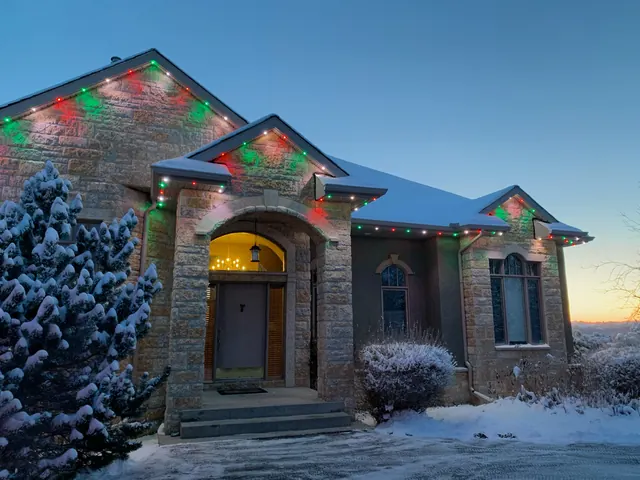 Warm white permanent roofline lighting on a Colorado home at night (photo 4 of 136)