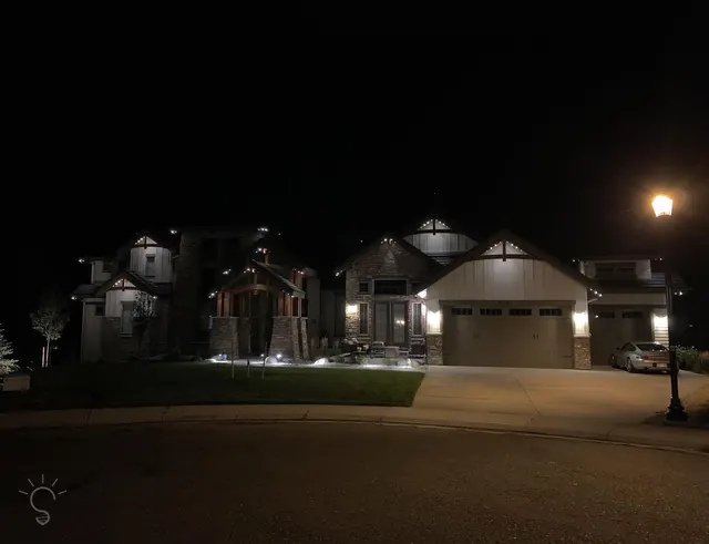 Warm white permanent roofline lighting on a Colorado home at night (photo 11 of 136)