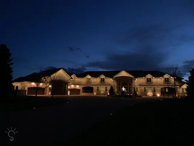 Gemstone permanent roofline lights in holiday colors on a Colorado home (photo 15 of 136)