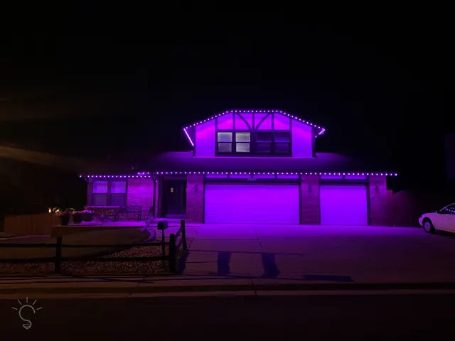 Gemstone permanent roofline lights in holiday colors on a Colorado home (photo 17 of 136)