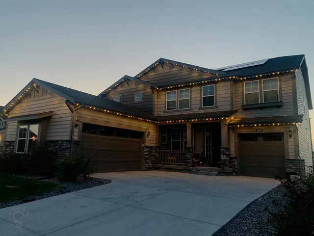 Warm white permanent roofline lighting on a Colorado home at night (photo 20 of 136)