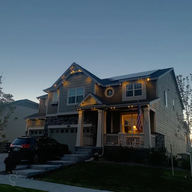 Warm white permanent roofline lighting on a Colorado home at night (photo 21 of 136)