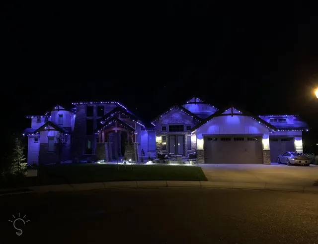 Gemstone permanent roofline lights in holiday colors on a Colorado home (photo 27 of 136)
