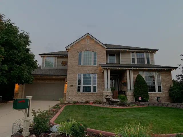 Warm white permanent roofline lighting on a Colorado home at night (photo 28 of 136)