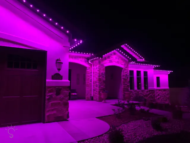 Gemstone permanent roofline lights in holiday colors on a Colorado home (photo 29 of 136)