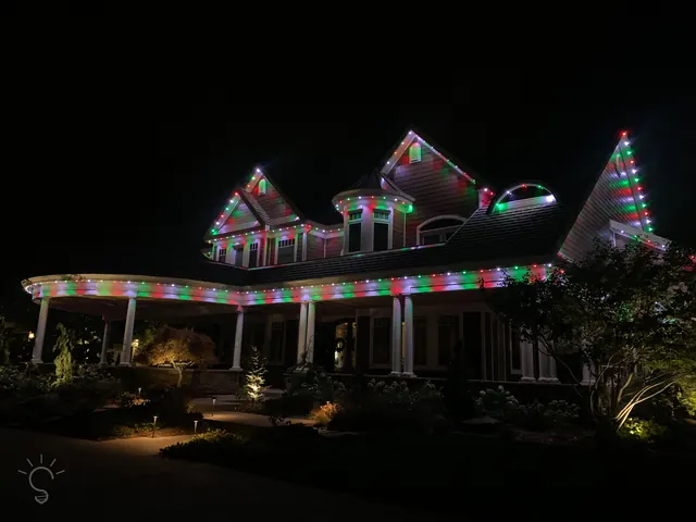 Warm white permanent roofline lighting on a Colorado home at night (photo 32 of 136)