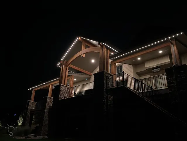 Warm white permanent roofline lighting on a Colorado home at night (photo 36 of 136)