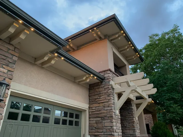 Warm white permanent roofline lighting on a Colorado home at night (photo 37 of 136)