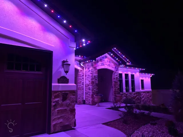 Gemstone permanent roofline lights in holiday colors on a Colorado home (photo 38 of 136)