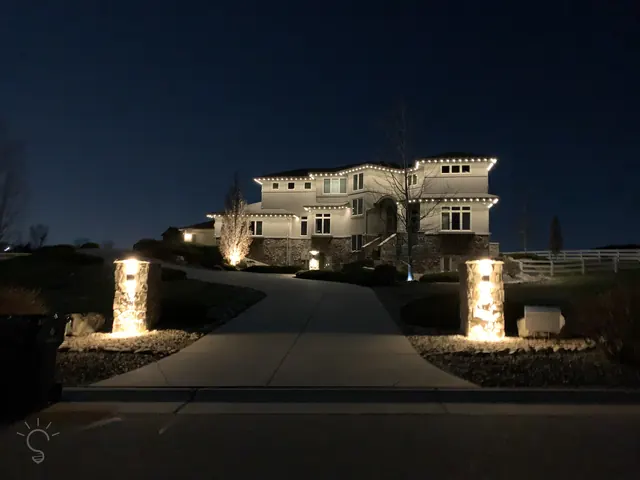 Warm white permanent roofline lighting on a Colorado home at night (photo 40 of 136)