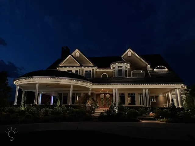 Warm white permanent roofline lighting on a Colorado home at night (photo 44 of 136)