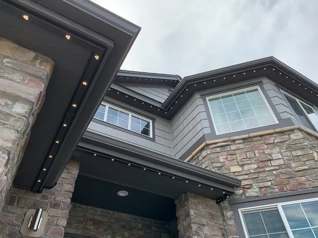 Warm white permanent roofline lighting on a Colorado home at night (photo 49 of 136)
