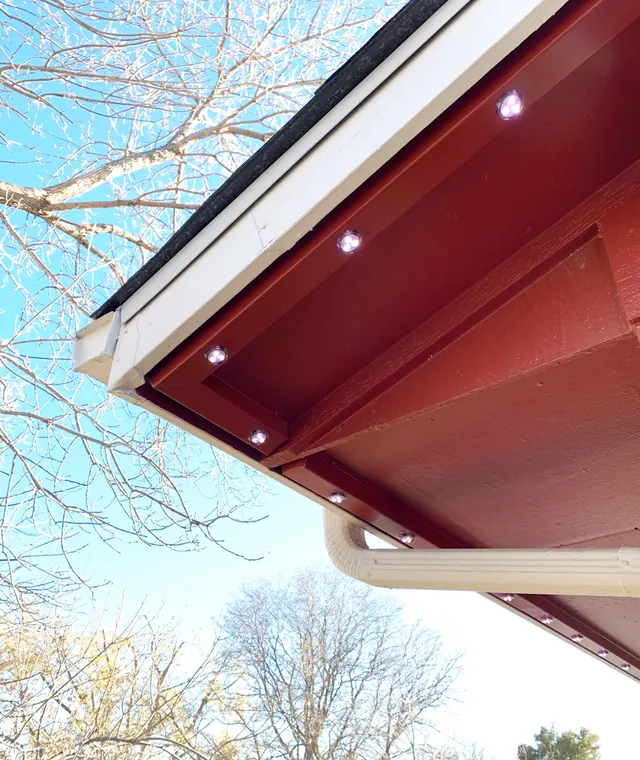 Gemstone permanent roofline lights in holiday colors on a Colorado home (photo 134 of 136)