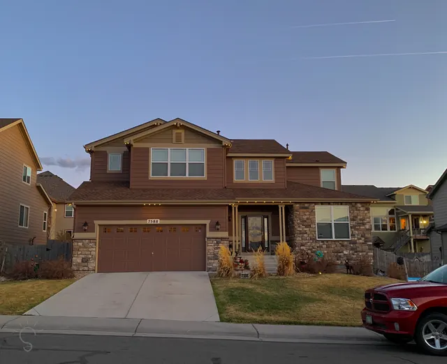 Warm white permanent roofline lighting on a Colorado home at night (photo 56 of 136)