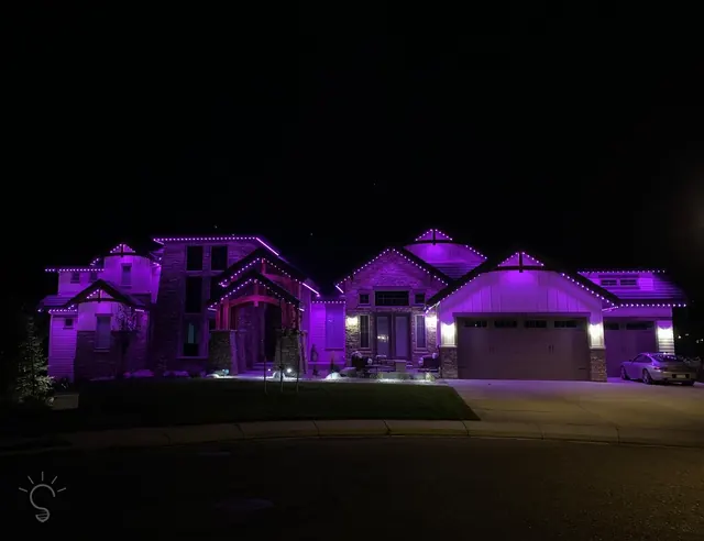 Gemstone permanent roofline lights in holiday colors on a Colorado home (photo 58 of 136)