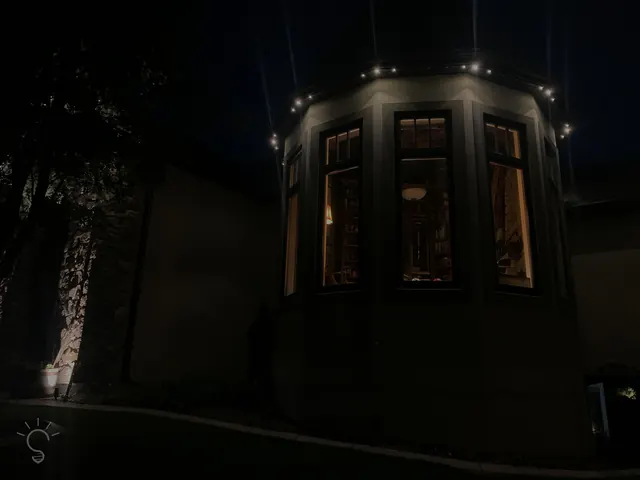 Warm white permanent roofline lighting on a Colorado home at night (photo 64 of 136)