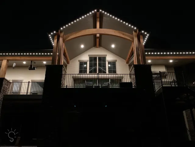 Warm white permanent roofline lighting on a Colorado home at night (photo 65 of 136)