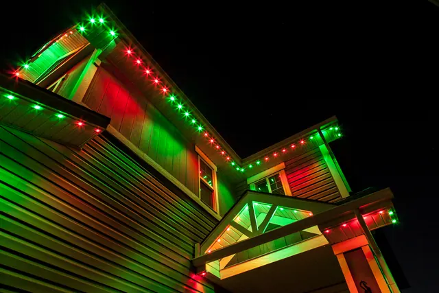 Gemstone permanent roofline lights in holiday colors on a Colorado home (photo 76 of 136)