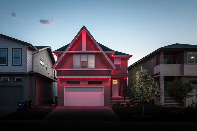Gemstone permanent roofline lights in holiday colors on a Colorado home (photo 79 of 136)