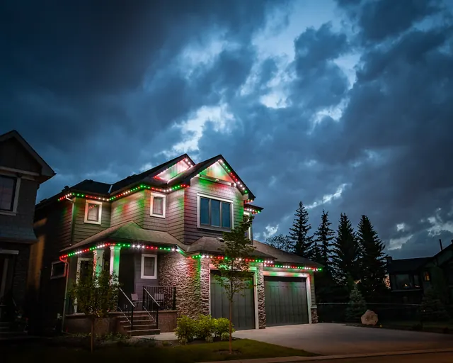 Gemstone permanent roofline lights in holiday colors on a Colorado home (photo 84 of 136)