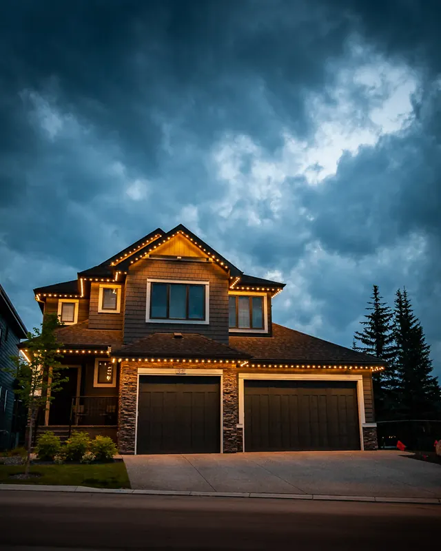 Warm white permanent roofline lighting on a Colorado home at night (photo 88 of 136)