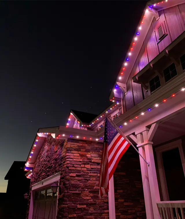 Gemstone permanent roofline lights in holiday colors on a Colorado home (photo 89 of 136)