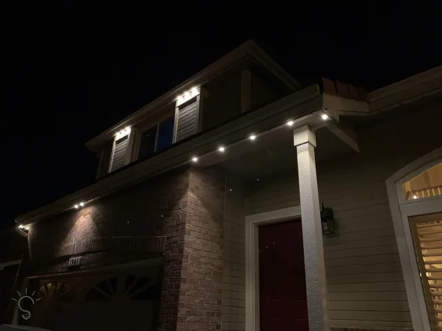 Warm white permanent roofline lighting on a Colorado home at night (photo 93 of 136)