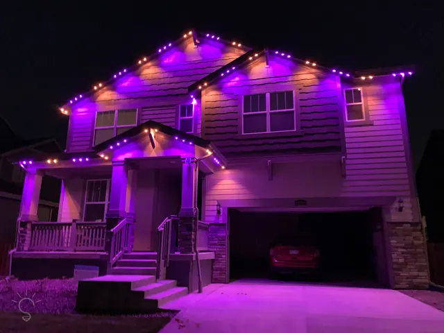 Gemstone permanent roofline lights in holiday colors on a Colorado home (photo 95 of 136)