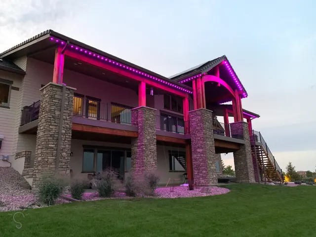 Gemstone permanent roofline lights in holiday colors on a Colorado home (photo 98 of 136)