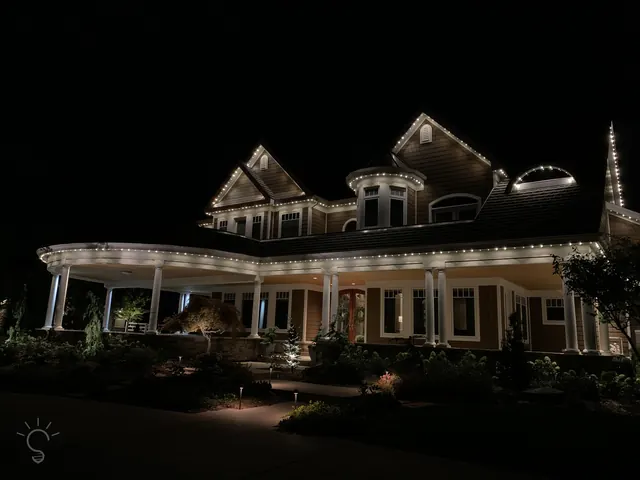Warm white permanent roofline lighting on a Colorado home at night (photo 103 of 136)
