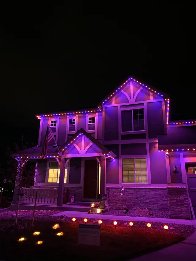 Gemstone permanent roofline lights in holiday colors on a Colorado home (photo 106 of 136)
