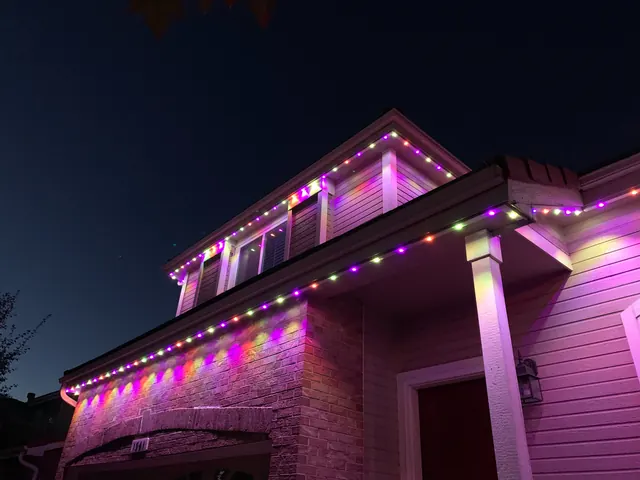Gemstone permanent roofline lights in holiday colors on a Colorado home (photo 109 of 136)
