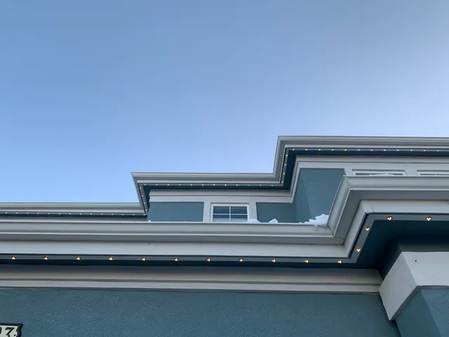 Gemstone permanent roofline lights in holiday colors on a Colorado home (photo 136 of 136)