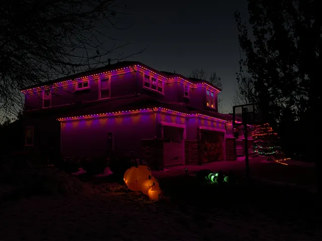 Gemstone permanent roofline lights in holiday colors on a Colorado home (photo 111 of 136)