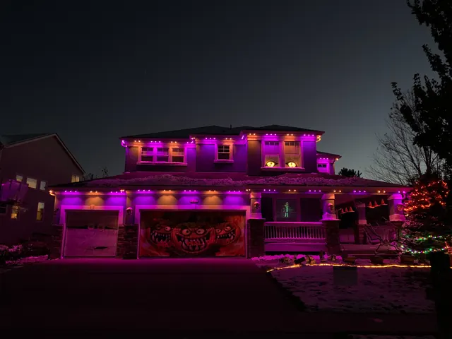 Gemstone permanent roofline lights in holiday colors on a Colorado home (photo 7 of 136)