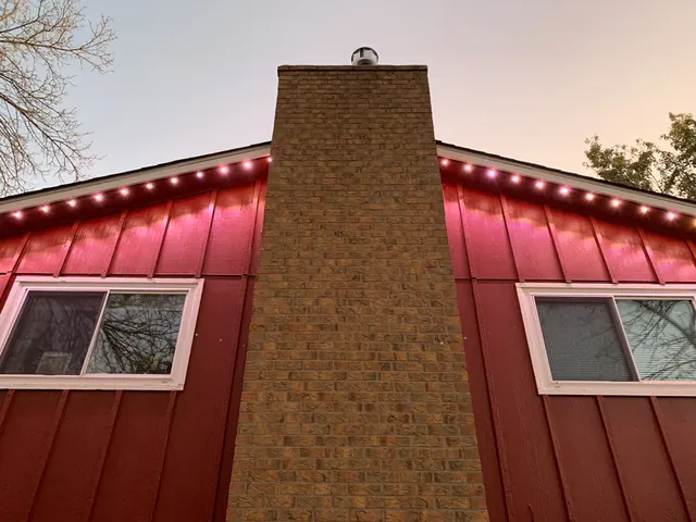 Gemstone permanent roofline lights in holiday colors on a Colorado home (photo 115 of 136)