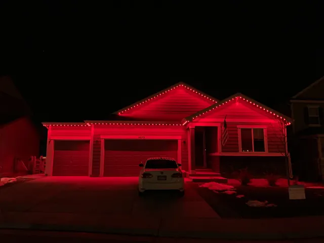 Gemstone permanent roofline lights in holiday colors on a Colorado home (photo 121 of 136)