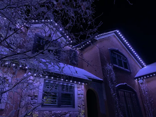 Gemstone permanent roofline lights in holiday colors on a Colorado home (photo 130 of 136)