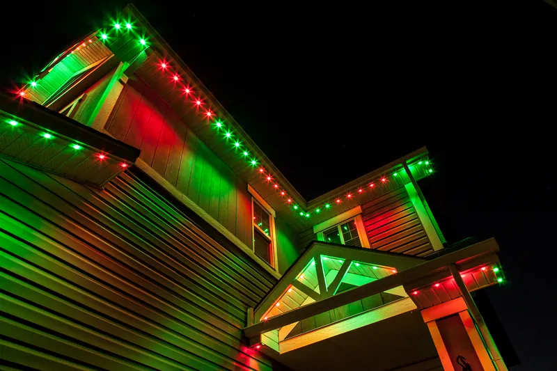 Roofline and gables lit in alternating red and green for Christmas